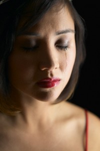 Close up of Asian woman crying