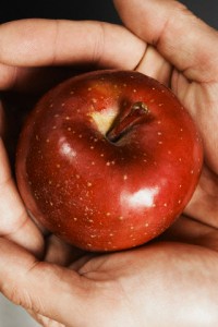 Man holding red apple