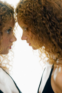 Woman Confronting Herself in Mirror